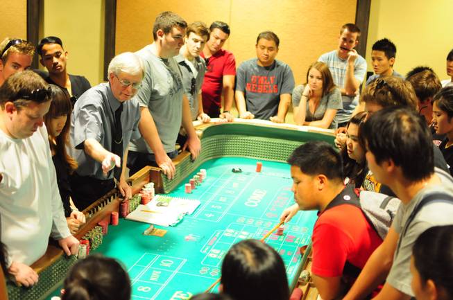 UNLV gaming professor Gary Waters explains the table game of craps to hotel college students at the Konami Gaming Lab on Tuesday, Oct. 30, 2012. The gaming lab gives students hands-on experience in casino management.