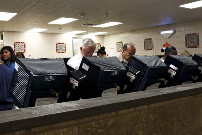 Sen. Harry Reid votes early at the Cardenas Market on East Bonanza in Las Vegas on Wednesday, Oct. 31, 2012.