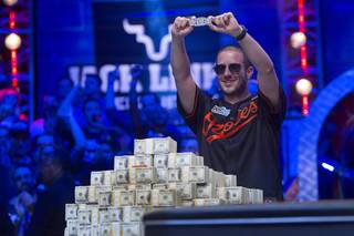 Greg Merson, 24, of Laurel, Md., holds up his championship bracelet after winning the 2012 World Series of Poker Main Event at the Rio on Wednesday, Oct. 31, 2012. Merson takes home a championship bracelet and $8.5 million in prize money. 