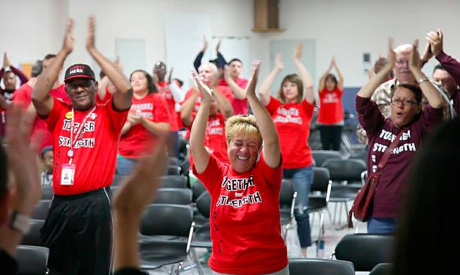 Members of Culinary 226 do a morning cheer before heading out to knock on doors as part of the union's get-out-the-vote effort, Oct. 28, 2012.