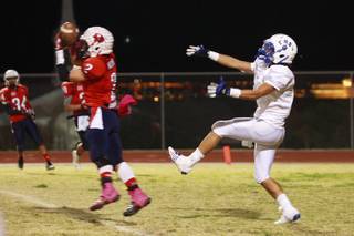 Coronado defensive back Cody Mucino intercepts a pass in the end zone intended for Basic wide receiver Anthony Owens late in the fourth quarter Friday, Nov. 2, 2012 at Coronado. Coronado shut out Basic after the first quarter for a 24-20 win. The interception killed Basic's final drive.