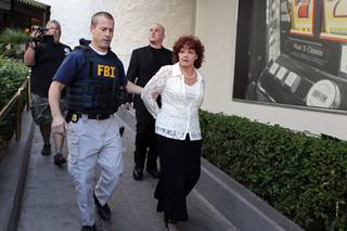 The FBI arrests Roxanne Rubin, who is charged with attempting to vote more than once in the same election, at the Riviera in Las Vegas on Friday, Nov. 2, 2012.