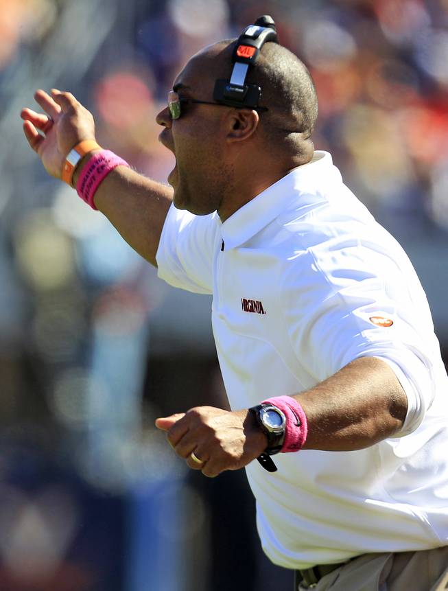 Virginia coach Mike London yells at an official during the first half of an NCAA college football game against Wake Forest at Scott Stadium in Charlottesville, Va., Saturday, Oct. 20, 2012. 