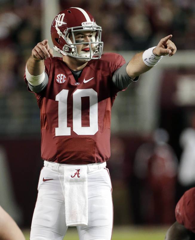 Alabama quarterback AJ McCarron (10) signals a play at the line of scrimmage during the first half of an NCAA college football game against Mississippi State at Bryant-Denny Stadium in Tuscaloosa, Ala.