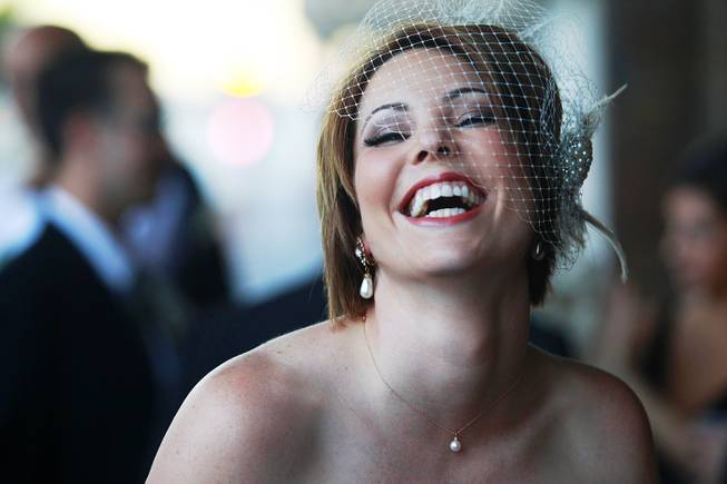 The soon-to-be Rachel Greene laughs during a photo shoot before her wedding.