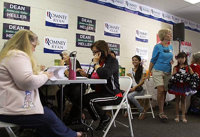 Mitt Romney campaign volunteers make phone calls Monday afternoon from an east Las Vegas campaign office as they await the arrival of Craig Romney and other campaign surrogates.
