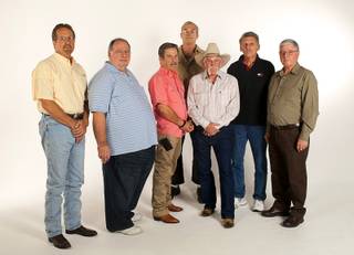 Firefighters pose at the Las Vegas Sun photo studio Wednesday, November 7, 2012. From left: Jim Perkins, Royce Leonard, John Jersey, Bert Sweeney, Skip Miller, Jerry Bendorf, and John Pappageorge. The firefighters were involved in fighting the MGM Grand fire in 1980. Eighty-five people died in the fire.