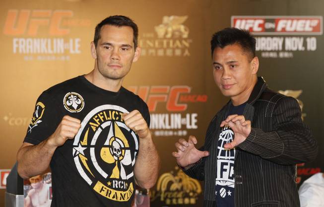 Former UFC middleweight champion Rich "Ace" Franklin, left, of the United States, and former Strikeforce middleweight champion Cung Le, a vietnamese-American, pose for photographers during the pre-fight press conference to promote the Ultimate Fighting Championship UFC in Hong Kong Wednesday, Nov. 7, 2012. The Ultimate Fighting Championship will take place in the Venetian Macao in Macau Saturday, Nov. 10.