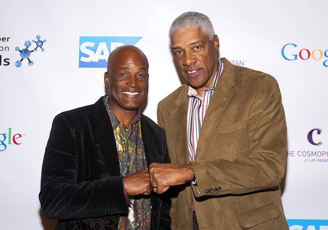 Playwright Kenny Leon, left, and basketball Hall of Famer Julius "Dr.J" Erving arrive for Reggie Jackson's 8th All-Star Celebrity Classic at the Cosmopolitan Sunday, Nov. 11, 2012. The event raised funds for the Mr. October Foundation for Kids, a charity that supports minority students pursuing education in science and technology.