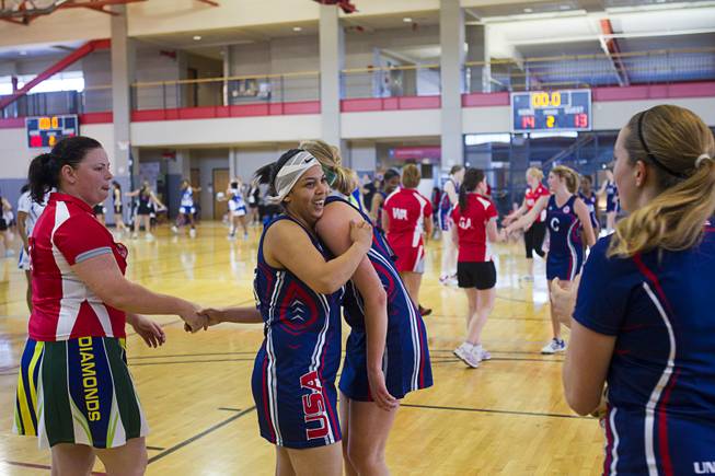 Ilze Gideons, center, of Team USA celebrates with a teammate after the team beat the Las Vegas Devils 14-13 in the final seconds of play during the 2012 CallidusCloud U.S. Open Netball Championships at UNLV campus Sunday, November 11, 2012. Emi Guimond scored the final basket.