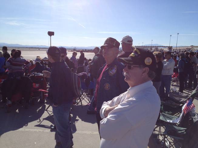 U.S. Army veterans Bill Roe (front) and Louis Rothstein watch the Aviation Nation air show on Veterans Day, Nov. 11, 2012. 