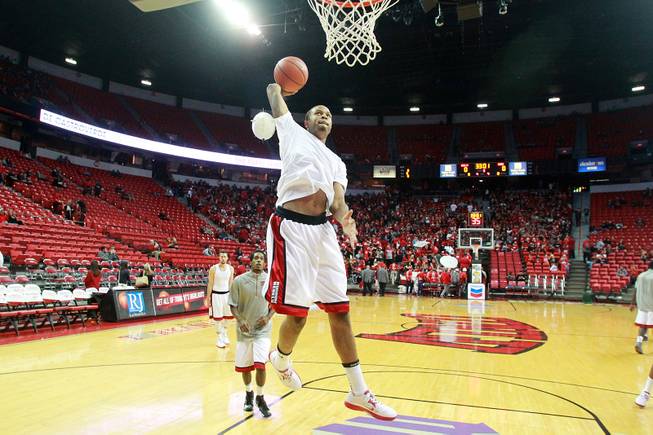 As a near sell out crowd trickles in, Bryce Dejean-Jones warms up with the rest of the Runnin' Rebels before their season opening game against Noprthern Arizona Monday, Nov. 12, 2012 at the Thomas & Mack.