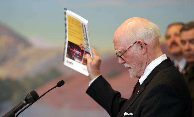 James "Chips" Stewart, a senior fellow of public safety at CNA Analysis & Solutions, holds up the report as he speaks during a press conference held by the U.S. Department of Justice Office of Community Oriented Policing Services at the Lloyd George Federal Building in Las Vegas on Thursday, November 15, 2012. The press conference was regarding an eight-month review of Las Vegas Metropolitan Police Department's use of force policies and practices.