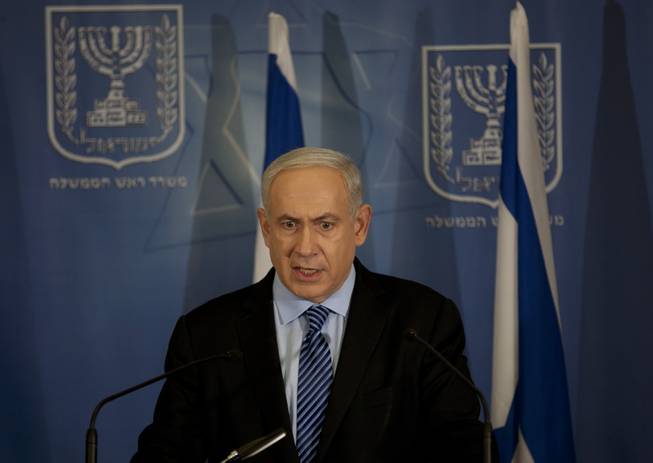 Israel's Prime Minister Benjamin Netanyahu delivers a statement to the media at Hakirya a military base in Tel Aviv, Israel, Wednesday, Nov. 14, 2012. Israel's prime minister says the military is prepared to broaden its operation against Hamas targets in Gaza. Netanyahu says Israel cannot tolerate continued rocket attacks against its citizens.