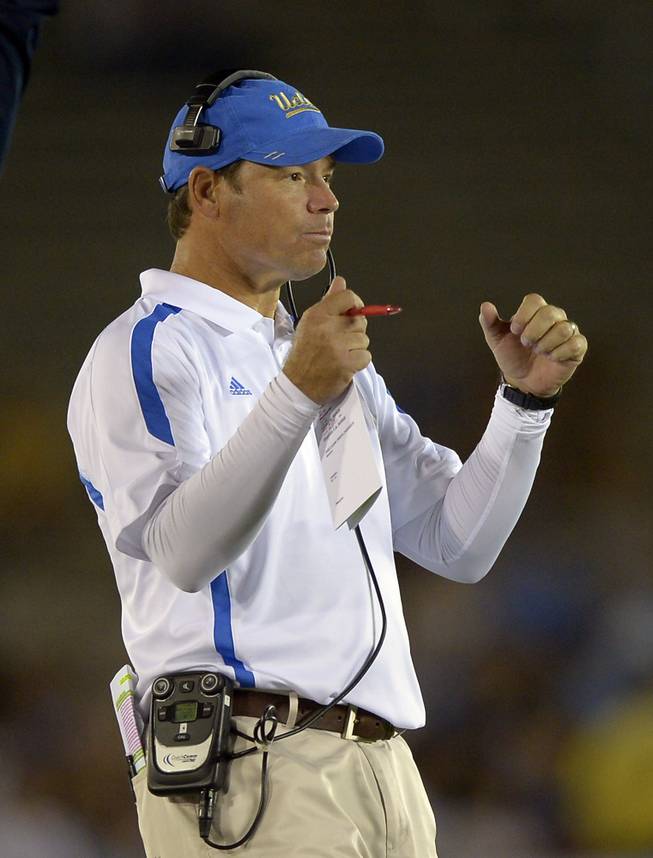 UCLA head coach Jim Mora gestures during the second half of their NCAA college football game against Houston, Saturday, Sept. 15, 2012, in Pasadena, Calif.