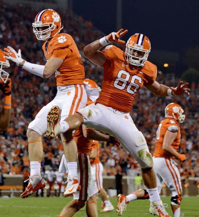 Clemson tight end Stanston Seckinger, left, celebrates with Sam Cooper after scoring a touchdown during the second half of an NCAA college football game against Maryland on Saturday, Nov. 10, 2012, at Memorial Stadium in Clemson, S.C. Clemson won 45-10.