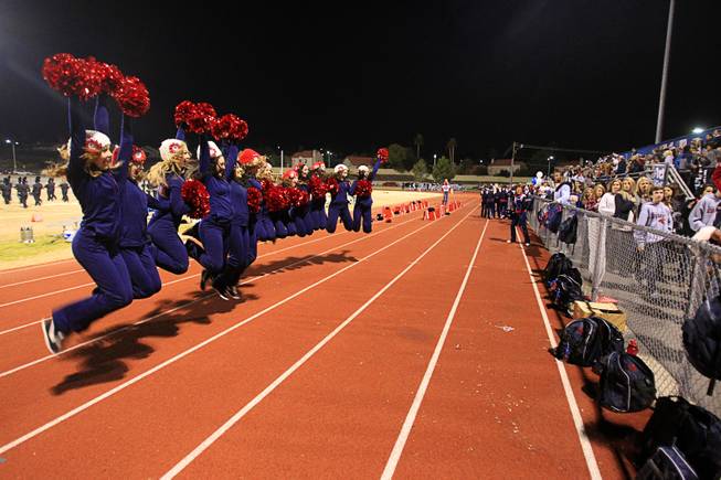 Members of the Cougarettes Dance team jump for a photo at halftime during the Sunrise regional semifinal at Green Valley High School in Henderson Friday, November 16 , 2012.