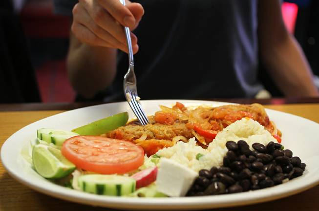 El Santaneco specializes in Guatemalan cuisine, but also serves El Salvadoran and Mexican dishes. Here, a diner prepares to dig into a chile relleno.
