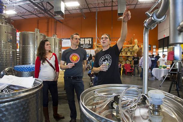 Stillman Sid Kindler explains the distilling process to Daniel and Jennifer Vandersteen during the Historic First Edition Day at the Las Vegas Distillery in Henderson Saturday, November 17, 2012. The event marks the first bottling of several new spirits and the grand opening of the Booze Brothers Beverage distribution company and the Half Full Artisan Shop at the Distillery, a retail store. The spirits include Nevada vodka, whiskey, gin, rum and moonshine.