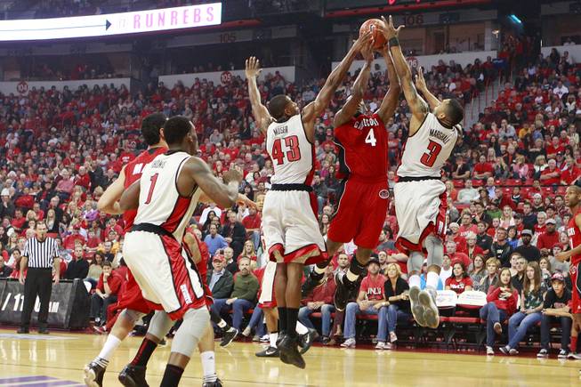 UNLV's Mike Moser and Anthony Marshall defend Jacksonville State forward Tarvin Gaines during their game Saturday, Nov. 17, 2012 at the Thomas & Mack.
