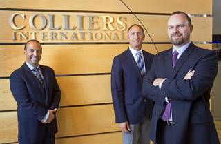 Gabriel Telles, left, Michael Mixer, center and Joshua Smith pose at Colliers International Monday, November 19, 2012. The trio are members of a Colliers gaming group focused on helping investors buy and sell casinos and gaming property.