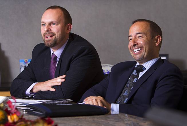 Joshua Smith, left, and Gabriel Telles react during an interview at the Colliers International commercial real estate brokerage Monday, November 19, 2012. Smith and Telles are part of a Colliers gaming group focused on helping investors buy and sell casinos and gaming property.