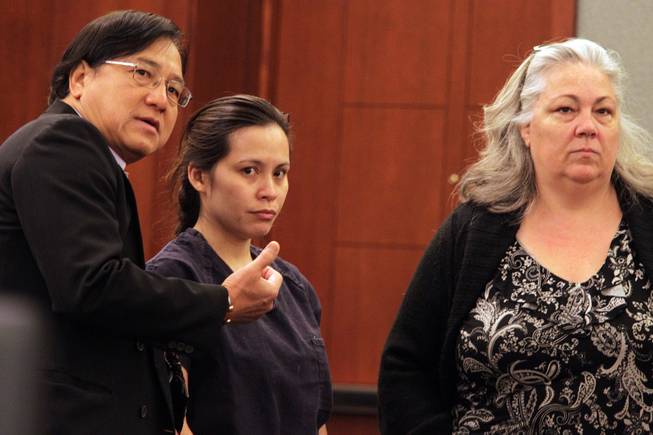 Sounilak Ouchlaeun, center, appears in court with interpreter Thirawat Apichonrattanakorn, left, and public defender Christy Craig, right, at the Regional Justice Center in Las Vegas on Tuesday, November 27, 2012.