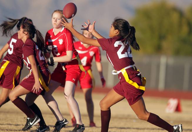 Briana Callejo of Cimarron-Memorial catches the ball during their girls flag football game against Arbor View at Cimarron-Memorial High School on Monday, November 26, 2012.