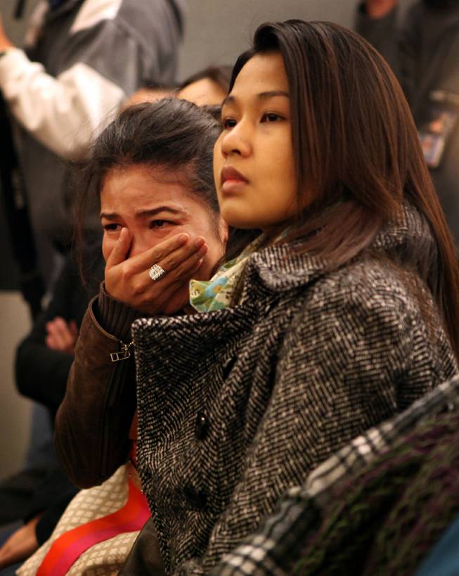 A supporter of Sounilak Ouchlaeun, who declined to be named, cries as she watches Ouchlaeun appear in court at the Regional Justice Center in Las Vegas on Tuesday, November 27, 2012. Ouchlaeun is charged with murder with a deadly weapon for running over her boyfriend with a car.