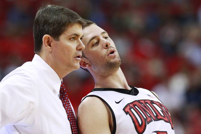 UNLV coach Dave Rice talks with guard Katin Reinhardt during their game against UC Irvine Wednesday, Nov. 28, 2012 at the Thomas & Mack. UNLV won the game 85-57.