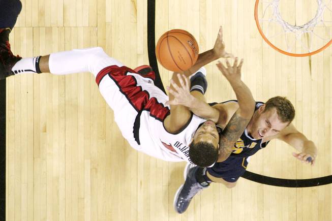UNLV guard Bryce Dejean-Jones is fouled by UC Irvine forward Adam Folker during their game Wednesday, Nov. 28, 2012 at the Thomas & Mack. UNLV won the game 85-57.