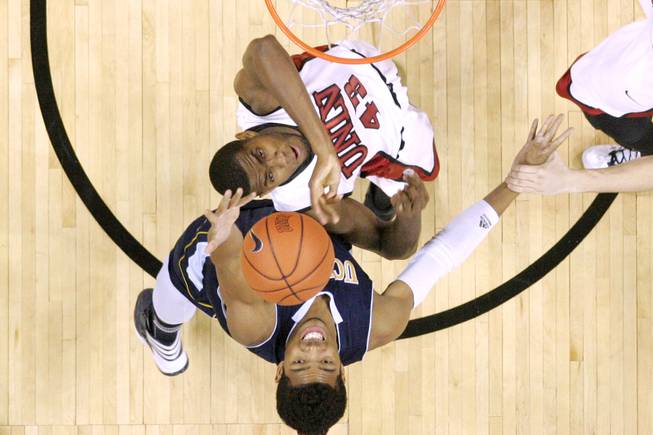 UNLV forward Mike Moser and UC Irvine forward Will Davis II reach for a rebound during their game Wednesday, Nov. 28, 2012 at the Thomas & Mack. UNLV won the game 85-57.