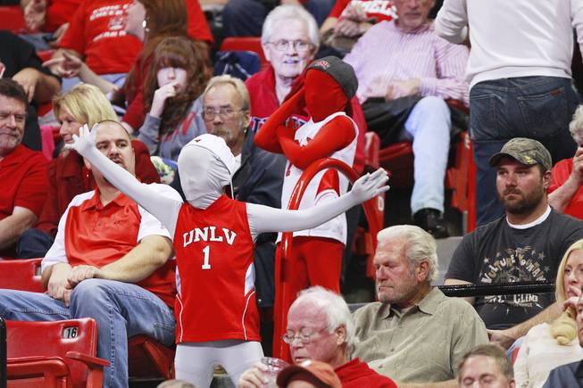 Two masked UNLV fans dance in the aisle during their game against UC Irvine Wednesday, Nov. 28, 2012 at the Thomas & Mack. UNLV won the game 85-57.