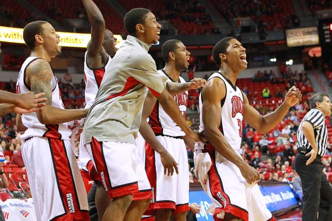 UNLV players celebrate after teammate Barry Cheaney made a basket against UC Irvine during their game Wednesday, Nov. 28, 2012 at the Thomas & Mack. UNLV won the game 85-57.