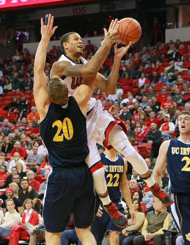UNLV guard Bryce Dejean-Jones shoots over UC Irvine forward Adam Folker during their game Wednesday, Nov. 28, 2012 at the Thomas & Mack. UNLV won the game 85-57.