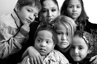 Almalinda Guerrero-Gonzales, center, with her children, from left, James Matthew Gonzales, 7, Henry James Gonzales, 3, Almalinda Gonzales, 7, Zabraamalatzka Rosales-Gonzales, 8, and Maria Guadalupe Gonzales, 5, at their home in Las Vegas on Wednesday, November 28, 2012. All of the Gonzales children have some sort of physical or mental disability.