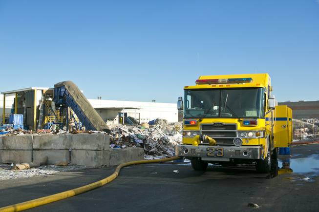 North Las Vegas Firefighters battle a fire at Secured Fibres, a recycling and waste management company near Craig Road and Interstate 15, Wednesday, Nov. 28, 2012.