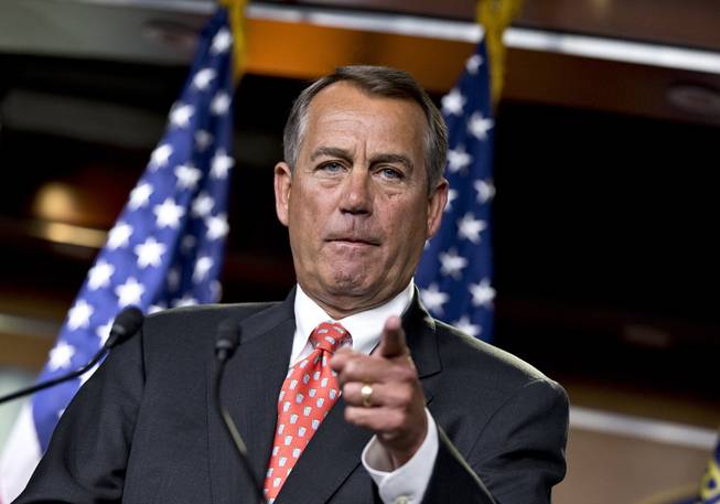House Speaker John Boehner of Ohio gestures as he speaks to reporters on Capitol Hill in Washington, Thursday, Nov. 29, 2012, after private talks with Treasury Secretary Timothy Geithner on the fiscal cliff negotiations. 