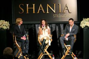 From left, costumier Mark Bouwer, Shania Twain and director Raj Kapoor hold a press conference at Caesars Palace for their upcoming show "Still the One" on Friday, Nov. 30, 2012.