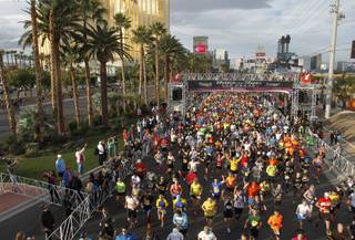 Runners are head out from the start line during the Zappos.com Rock 'n' Roll Las Vegas Marathon Sunday, Dec. 2, 2012.