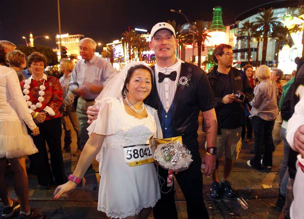 Jennifer Berkner and Michael Cagle of Fort Worth, Texas pose before getting married during the Zappos.com Rock 'n' Roll Las Vegas Marathon Sunday, Dec. 2, 2012.
