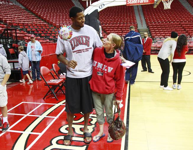 MIke Moser hugs his mother Jeanne Moser while posing for a photo after UNLV's exhibition game against Dixie State Nov. 7, 2012. Jeanne Moser was visiting not only to see Mike play but to celebrate his birthday.