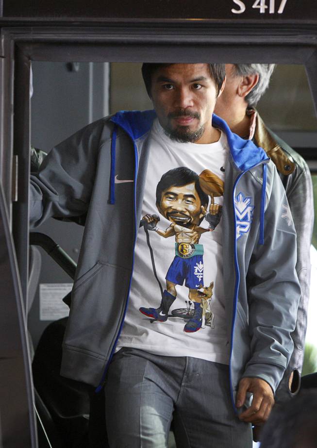 Filipino boxer Manny Pacquiao arrives at the MGM Grand Tuesday, December 4, 2012. Pacquiao will take on Juan Manuel Marquez of Mexico in a welterweight bout at the MGM Grand Garden Arena on Saturday. It will be the fourth time for the boxers to fight each other.