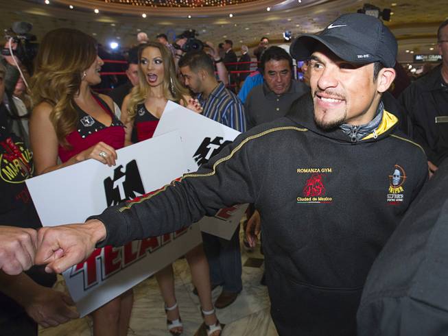 Mexican boxer Juan Manuel Marquez makes his way through the lobby of the MGM Grand Tuesday, December 4, 2012. Marquez will take on Filipino boxer Manny Pacquiao in a welterweight bout at the MGM Grand Garden Arena on Saturday. It will be the fourth time for the boxers to fight each other.