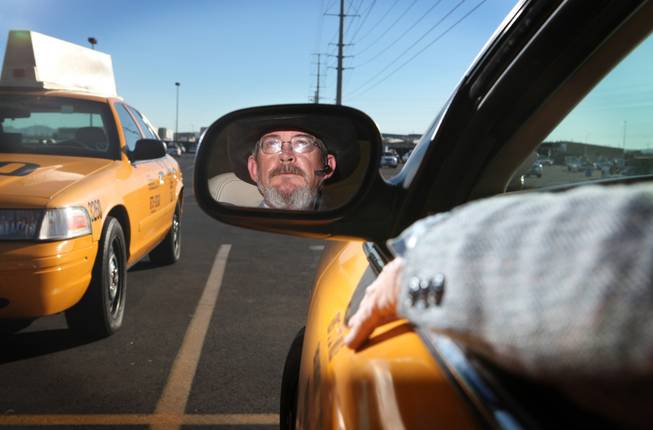 Cab driver George Allen sits in a cab at the Yellow-Checker-Star headquarters in Las Vegas on Tuesday, November 20, 2012.