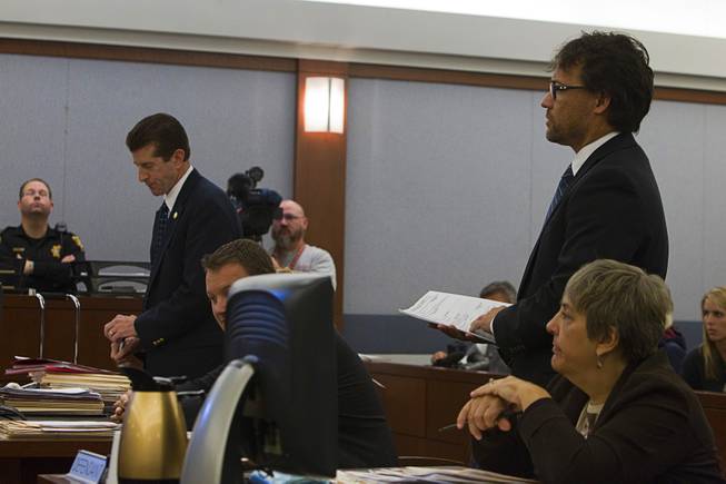 Michael Sanft, standing right, attorney for Dina Palmer, addresses the court at the Regional Justice Center Thursday, December 6, 2012.  Dina Palmer and Markiece Palmer are accused of killing 7-year-old Roderick Arrington.