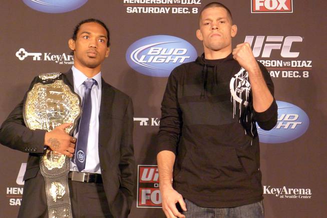 UFC lightweight champion Benson Henderson, left, and challenger Nate Diaz pose on Thursday Dec. 6, 2012 in advance of their main event Saturday on a UFC televised card.