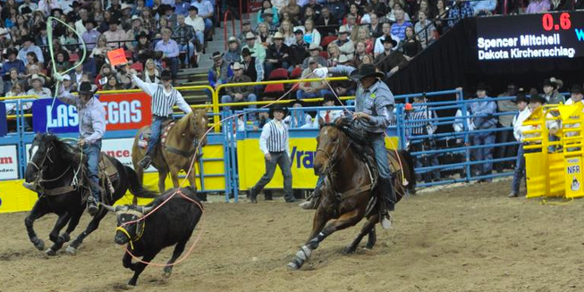 A foul was called on team ropers Spencer Mitchell and Dakota Kirchenschlager as they began their run Friday night during the second go-round at the Wrangler National Finals Rodeo in Las Vegas. The judges did not allow a rerun. 