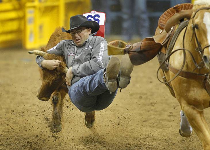 Matt Reeves of Cross Plains. Texas competes in steer wrestling during the fourth go-round of the Wrangler National Finals Rodeo at the Thomas & Mack Center Sunday, Dec. 9, 2012. The NFR continues through Saturday.