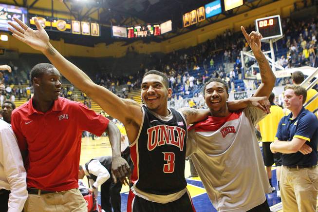 UNLV guards Anthony Marshall and Daquan Cook wave to Rebels fans after their 76-75 win over Cal on Sunday, Dec. 9, 2012, at Haas Pavilion in Berkeley, Calif.